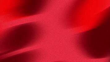 Flowing red satin fabric texture with soft waves and elegant shadows creating a dynamic and luxurious abstract background video