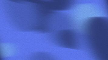 Abstract textured background in varying shades of blue with soft light transitions and a subtle grainy effect video