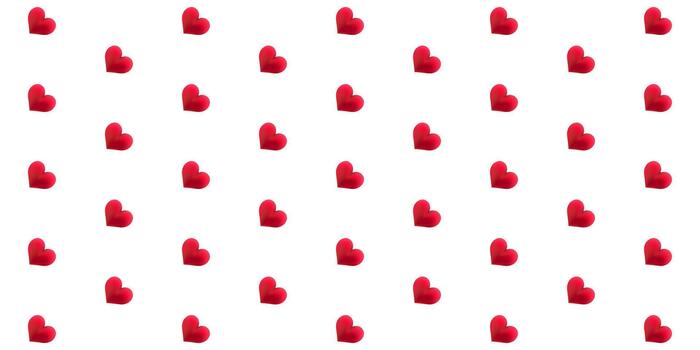 Seamless pattern featuring small, textured, red hearts arranged diagonally across a clean white background, ideal for textile or digital design vector