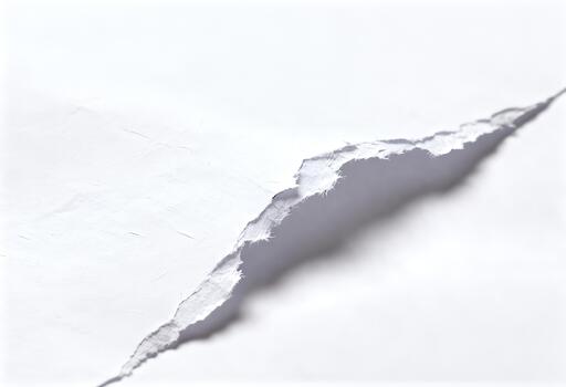 Torn paper with a jagged edge on a white background. photo