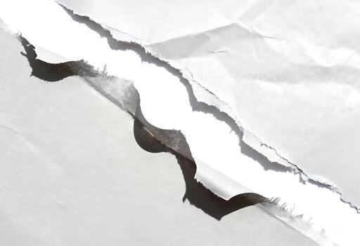 Abstract Crack in White Surface - A Study in Texture and Form. photo