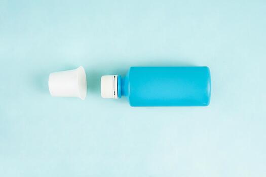 With the cap open, the bottle appears ready for use, adding a sense of immediacy to the scene photo