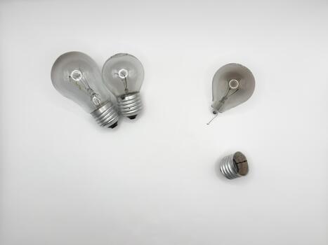 Tungsten light bulb lamp. Non-working light bulb, broken light bulb. Concept of light and dark, idea, electricity copy photo