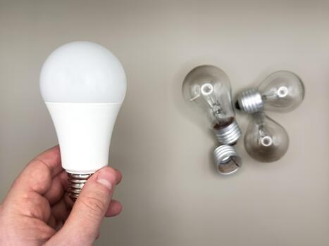 Modern LED lamp, saving electricity. Tungsten light bulb lamp. Non-working light bulb, broken light bulb. photo