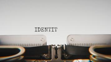 antiguo mecánico máquina de escribir mecanografía identidad cheque en un cerca arriba vista, con metal letras sorprendentes el blanco papel. video