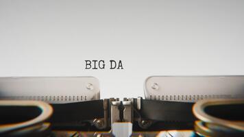 Old mechanical typewriter typing Big Data in a close up view, with metal letters striking the white paper. video