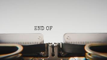 Old mechanical typewriter typing End Of Lettermissing Person File in a close up view, with metal letters striking the white paper. video