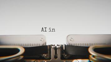 Old mechanical typewriter typing Ai In Society in a close up view, with metal letters striking the white paper. video