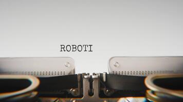 Old mechanical typewriter typing Robotics in a close up view, with metal letters striking the white paper. video