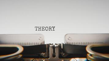 Old mechanical typewriter typing Theory in a close up view, with metal letters striking the white paper. video