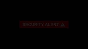 Security alert text with caution sign icon animation isolated on black background video