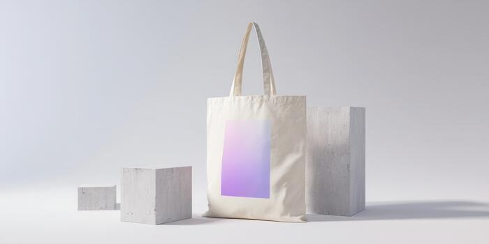 Stylish tote bag with a gradient design beside minimalist blocks photo