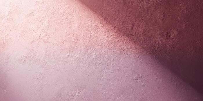 Beautiful pink textured wall with soft shadows photo