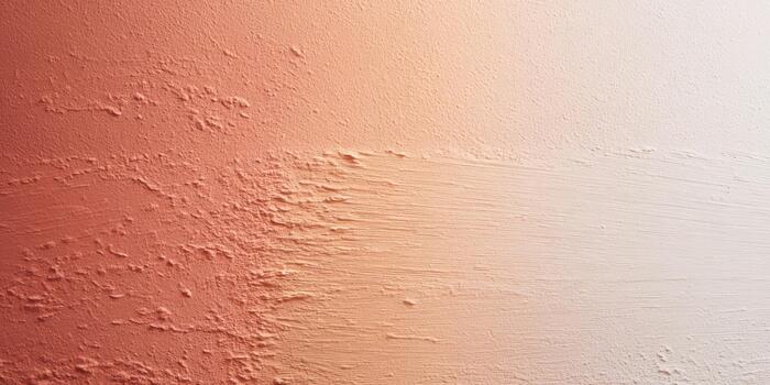 Warm gradient wall texture in soft peach tones photo