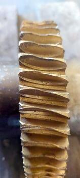 Detailed View of a Bronze Worm Gear Wheel Showcasing Its Intricate Design and Craftsmanship photo