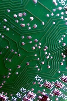 A close up of a circuit board with a small electronic device photo