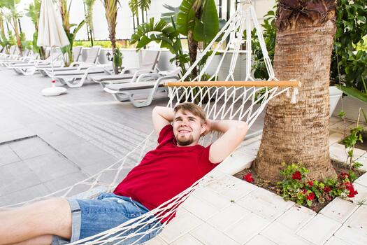 Man Relaxing In Hammock in summer photo