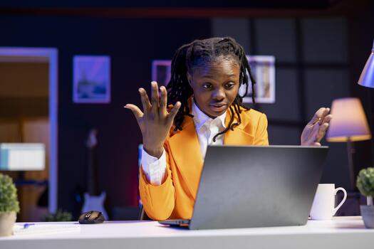 Confused remote employee calls manager remotely using internet videocall to ask for feedback on project progress. Teleworker at home requesting assistance from coworkers in teleconference meeting photo