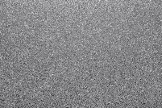 Silver glitter creating textured, shimmering surface. Background offering sparkling, abstract and metallic feel for design photo