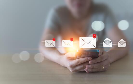 A woman sits and checks her email inbox to open it, whether it's for business or spam, using her mobile phone at home. convenient life, borderless communication with modern technology Background blur photo
