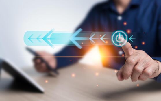 On off button, switch, and arrow virtual hologram icon drive the operation of the cutting-edge technology system and add orange light to the image. The businessman points to the start button. photo