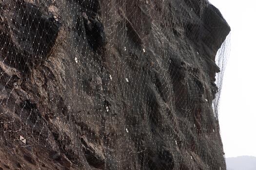 Steel protective net or mesh to prevent rockfall. rockfall protection netting prevent photo