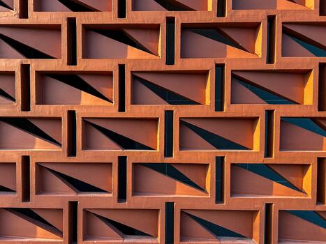 An abstract geometric wall design showcasing intricate and detailed patterns along with dynamic shadows photo