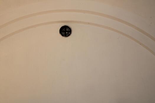 A clock on the wall of a building photo