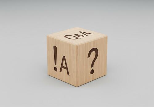 q and a concept q and a symbols on wooden cube block on a grey background illustration for frequently asked questions photo