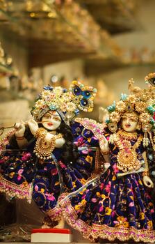 Radha Krishna Idols in Decorative Attire Displayed in Temple photo