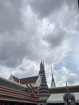Majestic View of Ancient Temple Architecture Under Dramatic Cloudy Sky in Southeast Asia photo