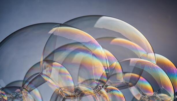 Colorful Soap Bubbles Close Up on Gray Background photo