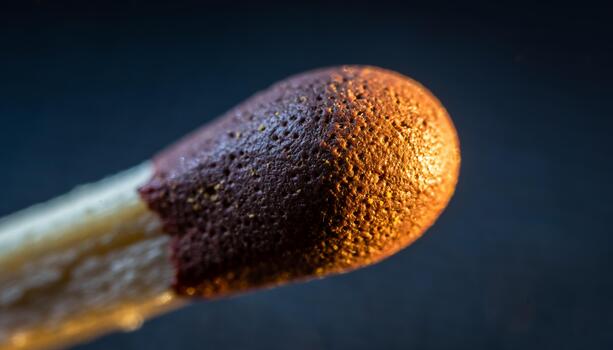 cerca arriba de quemado fósforo con carbonizado cabeza en oscuro antecedentes foto