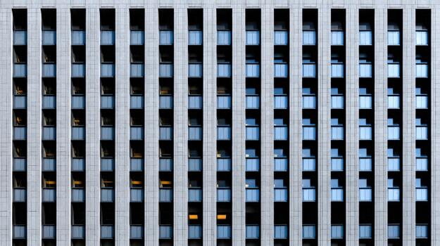 Modern architecture with vertical lines and glass in an urban setting photo