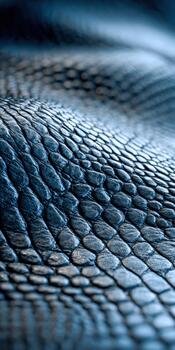 Detailed close-up of textured blue leather material with intricate patterns photo