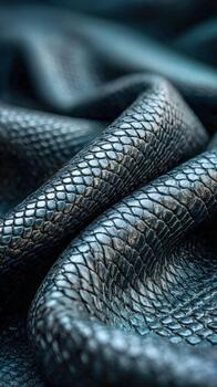 Textured dark leather fabric in soft folds showcasing its intricate design photo