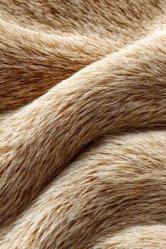 Soft brown textured fabric draping gracefully across a surface photo