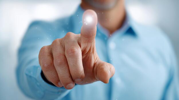 A close-up of a man's hand reaching forward, his finger poised to touch a glowing point of light, creating an ethereal atmosphere. photo