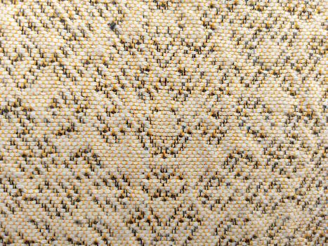 Intricate Woven Textile with Ornamental Floral Pattern Beige, Yellow, and Gray Threads in Symmetrical Design photo