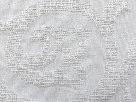Light-Colored Fabric with Vertical Loop Pattern Decorative Textile with Grid-Like Stitch Detail photo