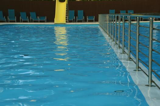 Fragment of a swimming pool with handrails, railings, fences. photo