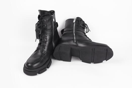 Black youth light boots with high soles for cool spring weather with rain on a light background with light shade photo