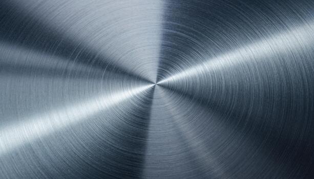 Brushed Metal Surface with Radiant Circular Texture Creating a Dynamic Metallic Abstract Background photo