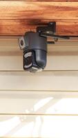 A close-up surveillance camera on the roof of the house rotates in different directions to assess the situation in the adjacent area video