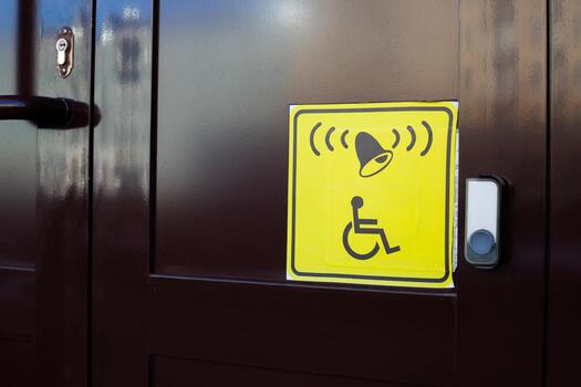 Concept for assisting people with disabilities. Universal sign for people with disabilities showing location to press help button. Press button and receive assistance photo