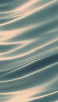 Captivating flowing satin fabric texture in light blue and beige creating an abstract elegant background video