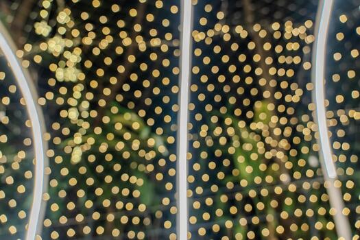 Warm golden bokeh fills the frame with soft circles of unfocused light, while curved LED lines create a bright tunnel effect in the background.c photo