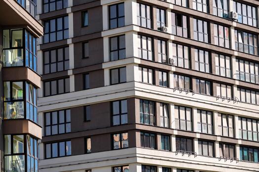 A building with many windows and a clock on it photo
