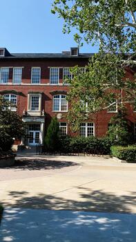 Brick campus building with trees and shade in Southern Illinois University Carbondale, USA campus scene photo
