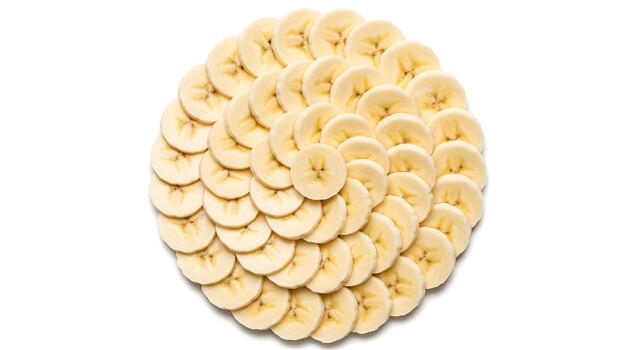 Fresh Banana Slices Arranged in a Circular Pattern on White Background photo